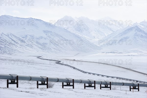 Oil pipeline from Prudhoe Bay to Valdez in the Arctic winter along the Dalton Highway