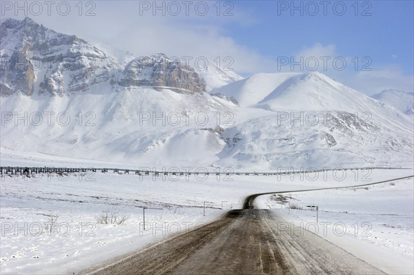 Oil pipeline from Prudhoe Bay to Valdez in the Arctic winter along the Dalton Highway