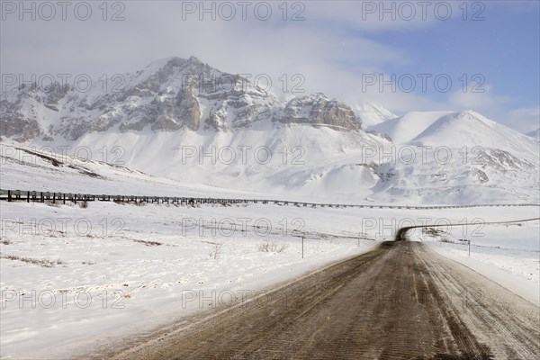 Oil pipeline from Prudhoe Bay to Valdez in the Arctic winter along the Dalton Highway