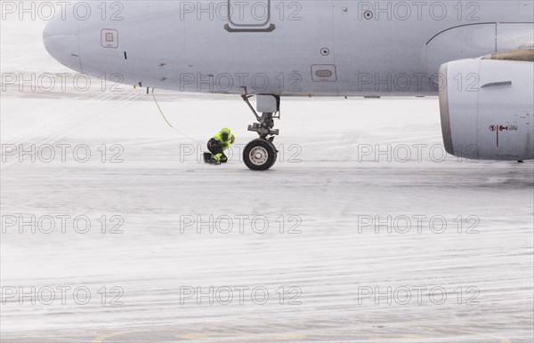 Aircraft check in winter on snow-covered runway