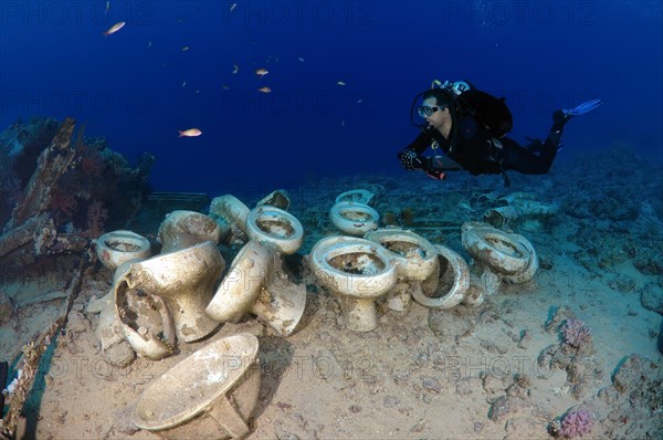 Diver looking at the plumbing on the shipwrecks in Ras Muhammad National Park