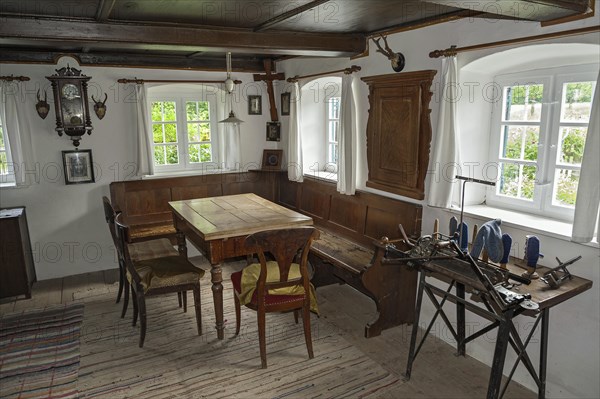 Room with altar and old knitting machine Bauernhofmuseum Jexhof