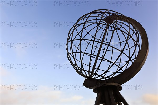 Globe on the North Cape platform against a blue sky