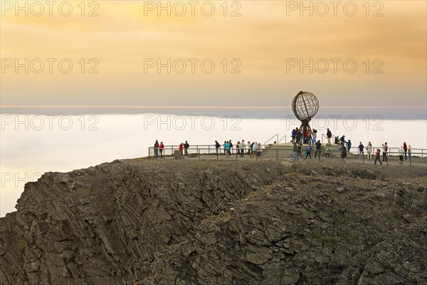 Nordkapp platform with globe in front of evening sky