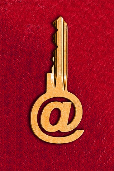 @ sign key against a red background