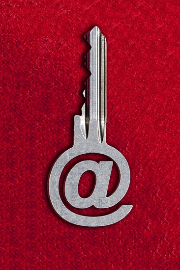 @ sign key against a red background