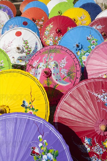 Handmade paper parasols drying in the sun at an umbrella factory in Bo Sang