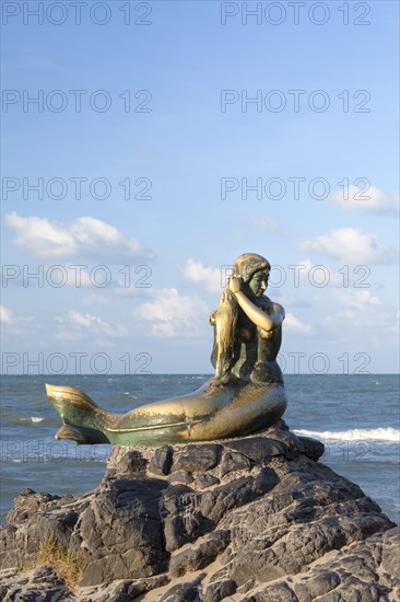 Golden mermaid statue on Samila beach