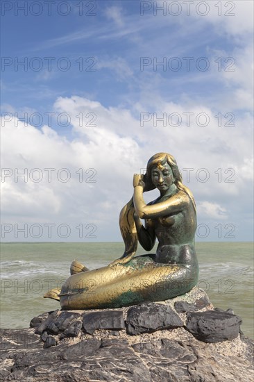 Golden mermaid statue on Samila beach