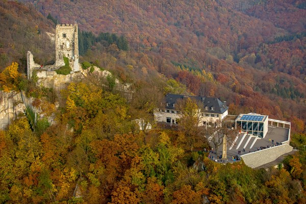 Drachenfels castle ruins with plateau and glass cube in the fall