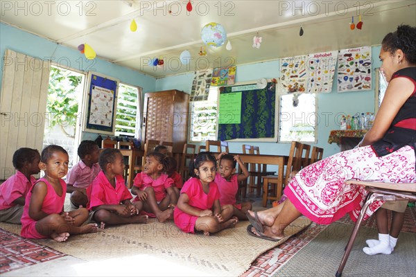 Primary school class in uniform during lesson