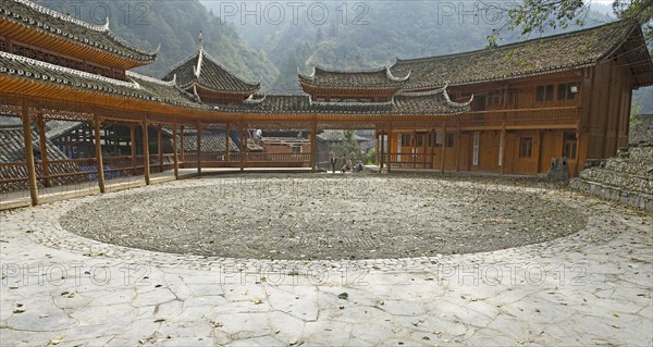 Traditional pagodas line the meeting place in the Miao village of Langde