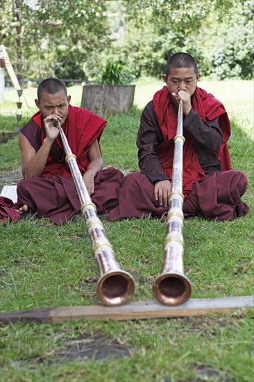 Monks playing tibetan horns