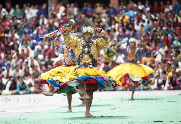 Dancers and spectators at the Tashichho Dzong monastery festival