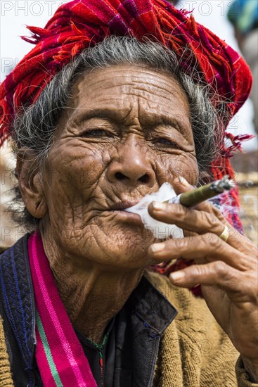 Smoking old woman from the Pao hilltribe or mountain people