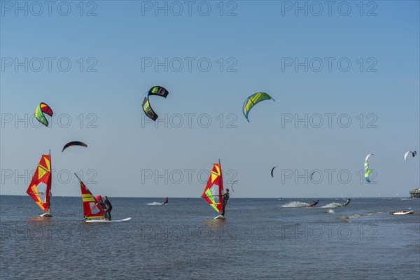 Kitesurfers and windsurfers