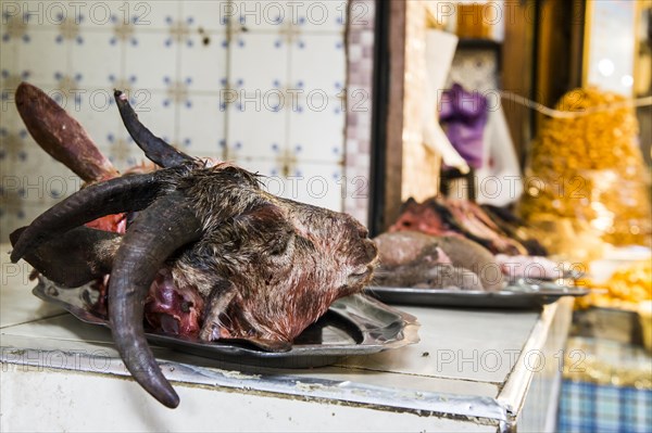 Butcher's with goat head on display
