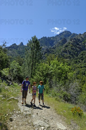 Hikers at the Cirque de Bonifatu Boucle de Ficaghiola at the long-distance trail Tra Mare e Monti and GR20