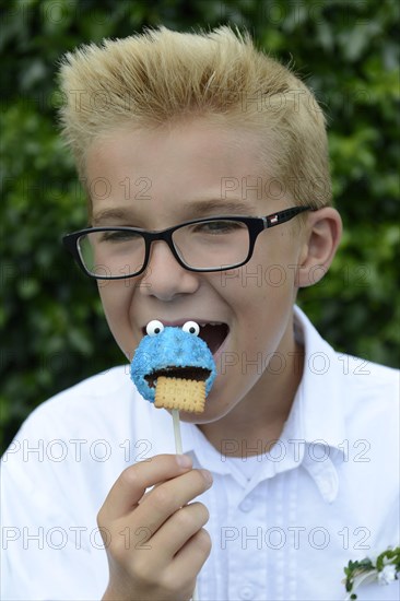 Boy eating a cake pop