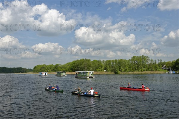 Houseboats and canoeists on Lake Vilzsee