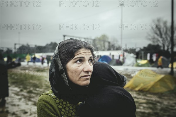 Mother with small child in her arms