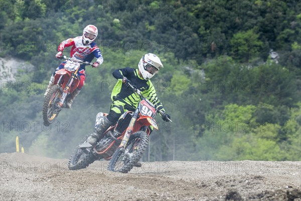 Two motorcyclists on motocross bikes