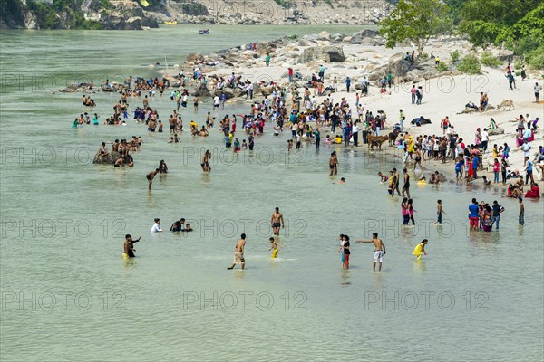 Pilgrims are taking bath at the banks of the holy river Ganges