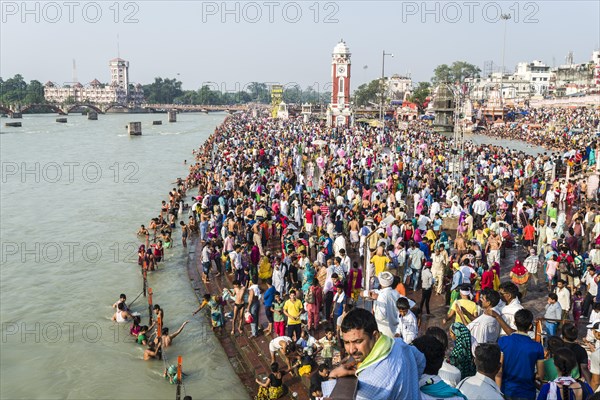 Masses of pilgrims are gathering for bathing at Harki Pauri Ghat at the holy river Ganges