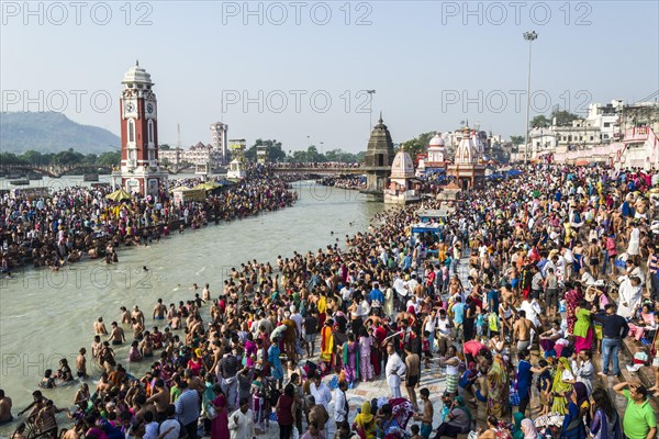 Masses of pilgrims are gathering for bathing at Harki Pauri Ghat at the holy river Ganges