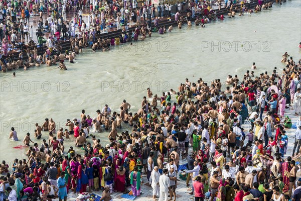 Masses of pilgrims are gathering for bathing at Harki Pauri Ghat at the holy river Ganges