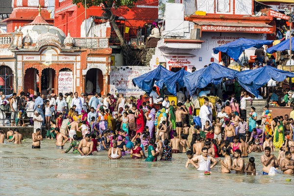 Masses of pilgrims are gathering for bathing at Harki Pauri Ghat at the holy river Ganges