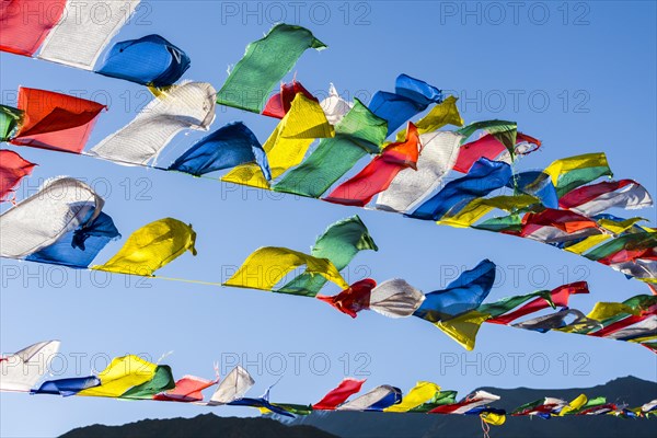 Tibetan prayer flags waving in the wind at Lamayuru Gompa