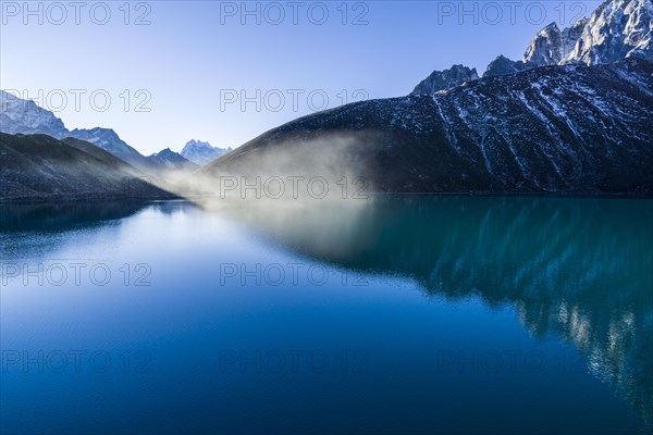 Morning mist over Gokyo Lake at sunrise