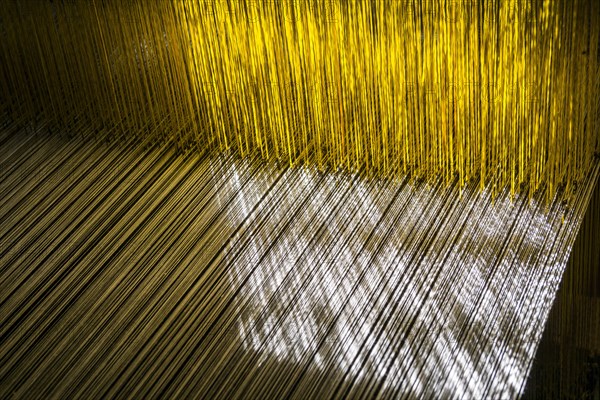 Detail of the old traditional looms for weaving the material for the traditional nepali Dhaka topi hats