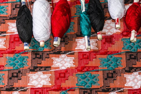 Colorful threads for weaving the Dhaka topi