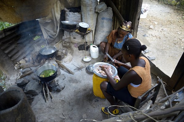 Women cooking in a simple kitchen