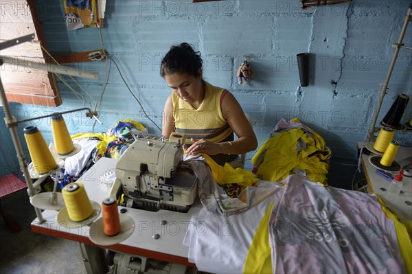 Seamstress in Comuna 8 slum