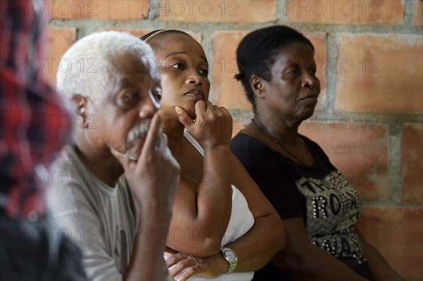 Women un man at the village assembly