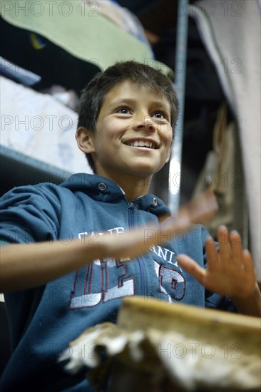 Boy cheerful drumming