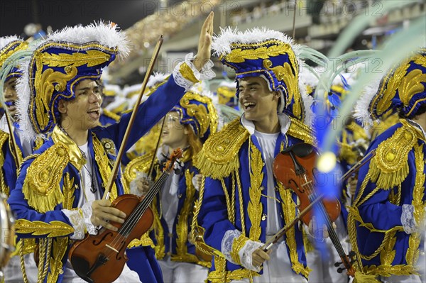 Teenagers in costumes with violins