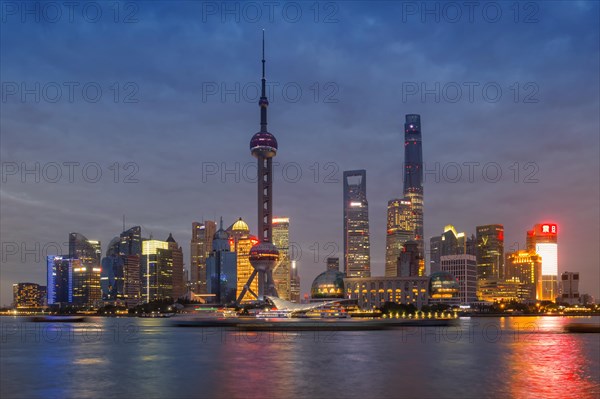 Pudong financial district with Oriental Pearl Tower at night