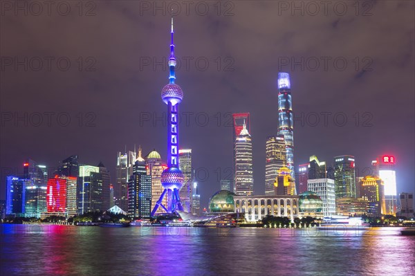 Pudong financial district with Oriental Pearl Tower at night