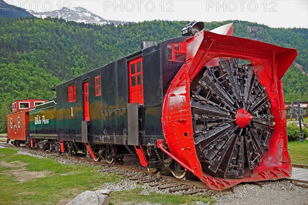 Historic locomotive with snow blower at train station