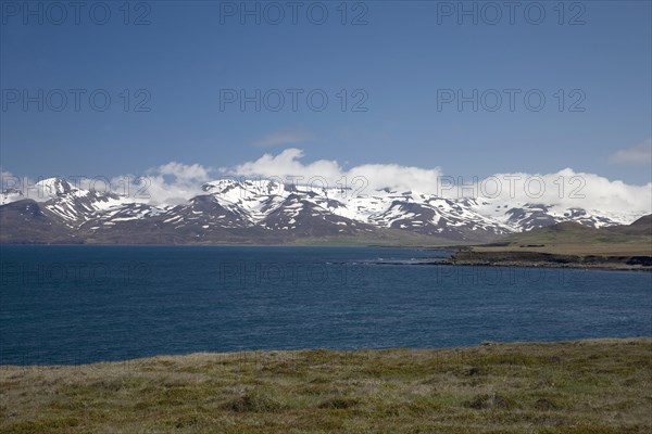 Snowy mountains along bay north of Trollaskagi Peninsula