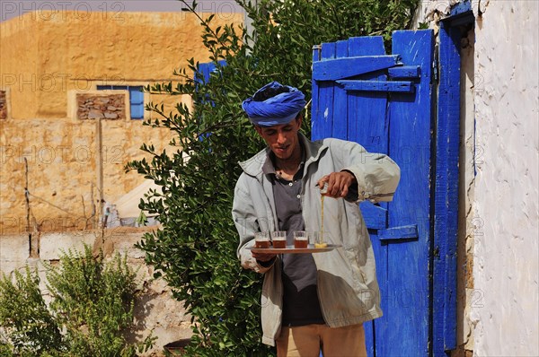 Man pouring tea