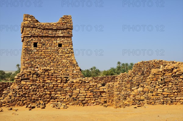 Ruins and minaret of the fortified trading post or Ksar