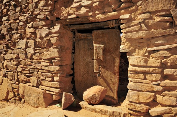 Old wooden door in the fortified trading post or Ksar