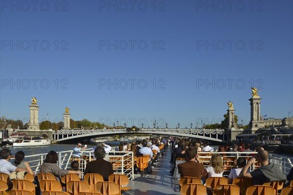 Excursion boat on the river Seine in front of Pont Alexandre III