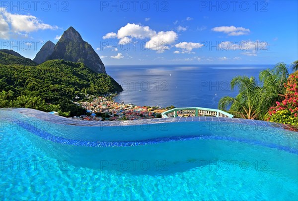 Swimming pool of the La Haut Resort with view of the village and the two Pitons