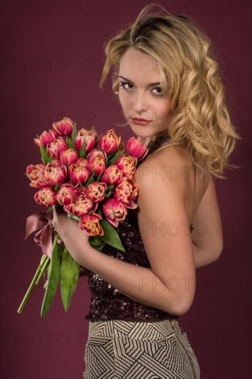 Young woman with a bouquet of tulips